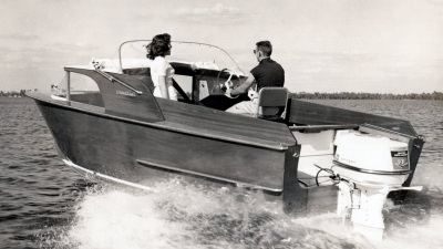Man driving boat on water