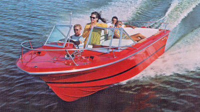 Red boat cruising through water