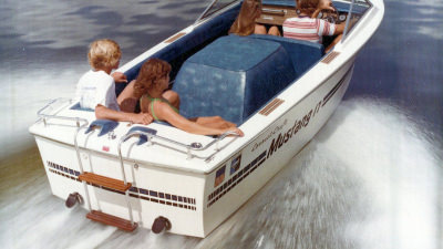 Correct Craft Mustang boat cruising on lake